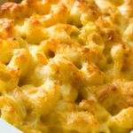 Crispy golden macaroni and cheese in a casserole dish.